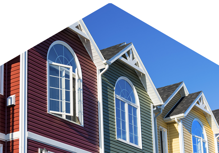 Row of colorful homes against blue sky